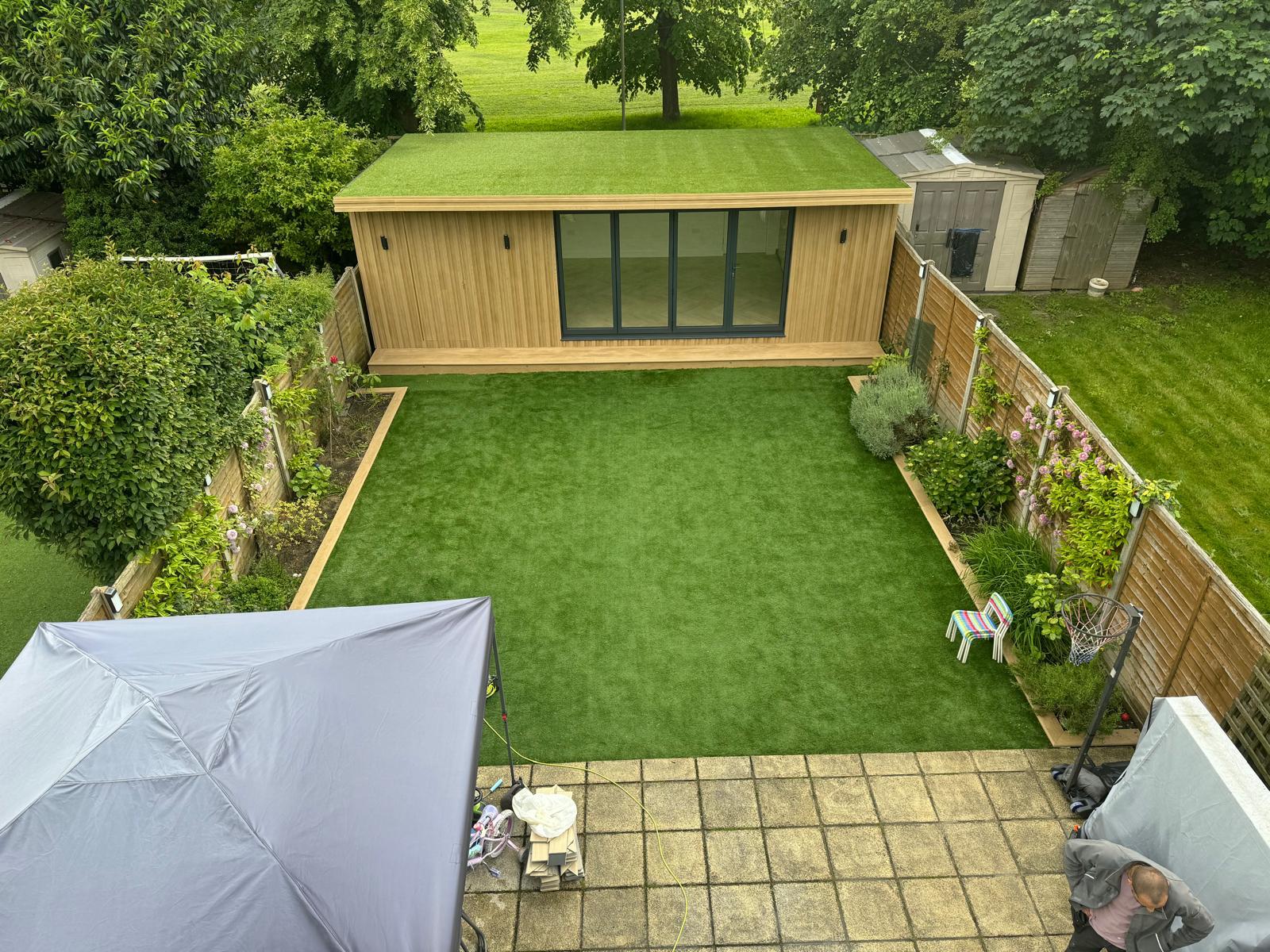 Elegant garden room featuring large windows and natural decor
